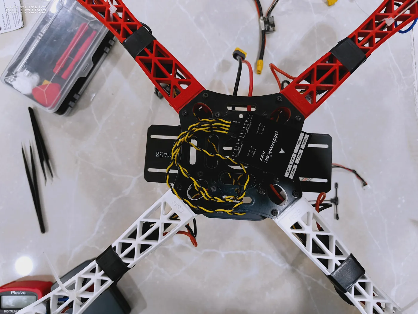 Top view of the quadcopter centre plate showing the flight controller wiring
