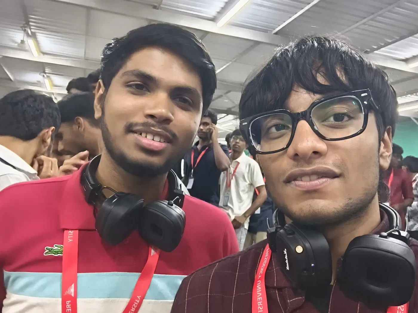 Selfie of Sonu Kumar Suman with a friend at an event, both wearing lanyards