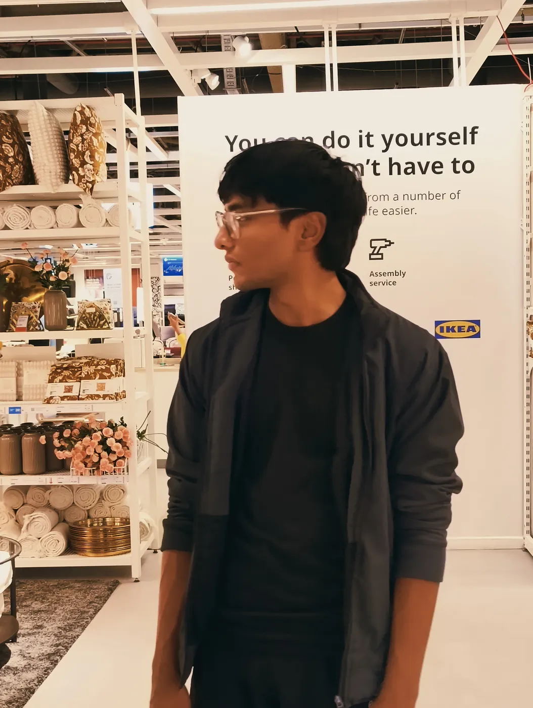 Sonu Kumar Suman in a black jacket inside a home furnishing store